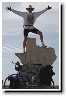 Tim Wheat standing on the Texas - New Mexico boarder.