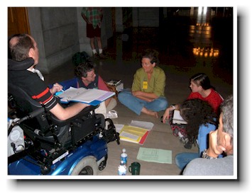 Leadership team meets on the floor.
