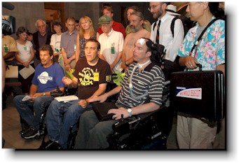 About 20 activists speak with the press.