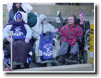 ADAPT shuts down HHS in March of 2004, Barbara Bounds of Memphis is in the center of this photo.