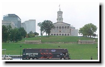 Rolling Freedom Express Bus passes the Tennessee state Capitol building.
